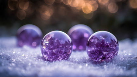 Purple glass Christmas balls on snow with bokeh background.の素材