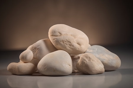 Pile of white stones on a dark background with copyspaceの素材