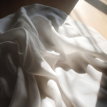 White silk fabric on the floor in the sunlight. Soft focus.の素材