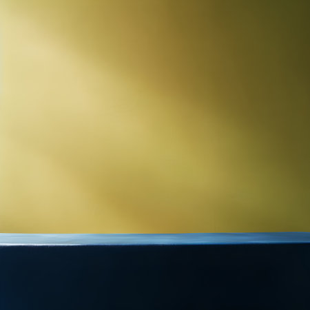 Empty blue table top on yellow gradient background, product display montageの素材