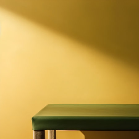 Green chair on a yellow background, with a shadow on the wallの素材