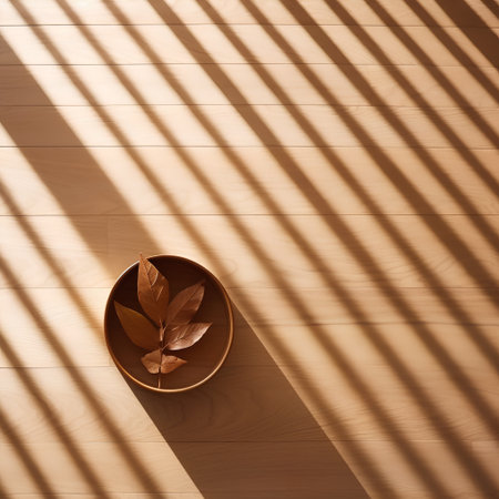 Wooden bowl with autumn leaves and shadow from the window on the floorの素材