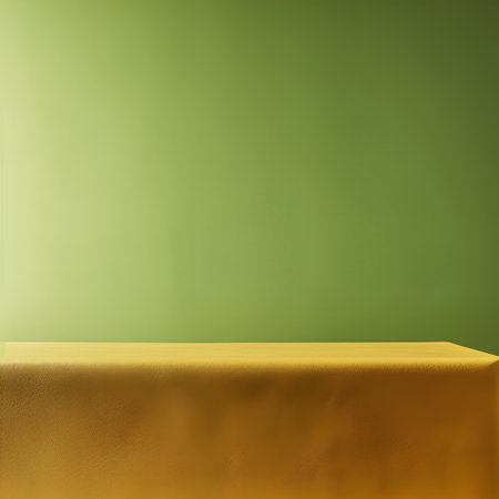 Yellow pedestal against a green wall with copy space for your productの素材