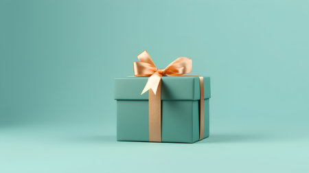 Green gift box with gold bow on turquoise background. 3d renderの素材