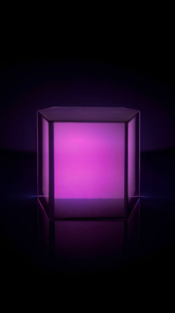 Illuminated glass cube with purple light on a black background.の素材