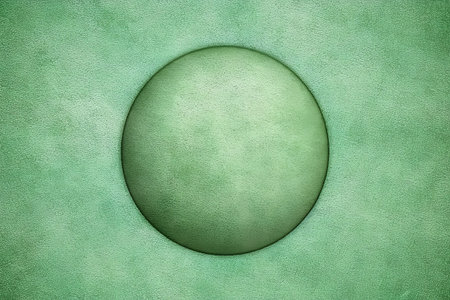 Easter egg on green textured paper background. High resolution photo.の素材