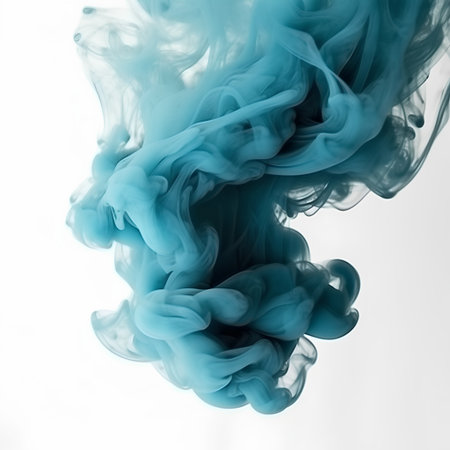 Blue ink in water on a white background. Abstract background for design.の素材