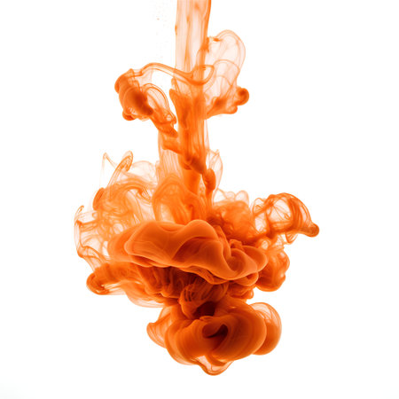 Orange ink in water isolated on white background. Abstract background for design.の素材