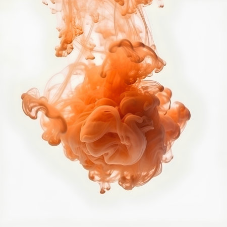 Orange ink in water isolated on white background. Abstract background for design.の素材