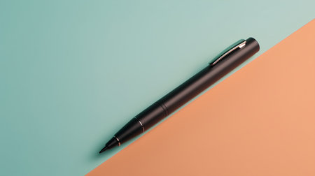 Black pen on a blue and orange background. Top view, flat lay.の素材