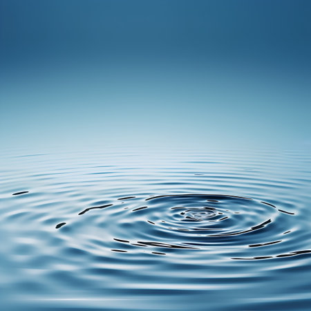 Water ripples with ripples and waves on a blue background.の素材