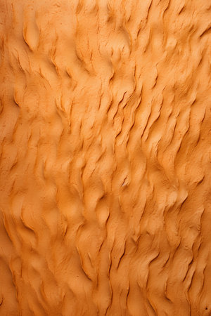 Texture of orange clay wall. Abstract background and texture for design.の素材