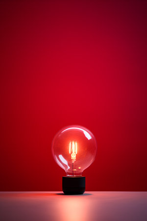 Light bulb on red background. 3D rendering. Illustration.の素材