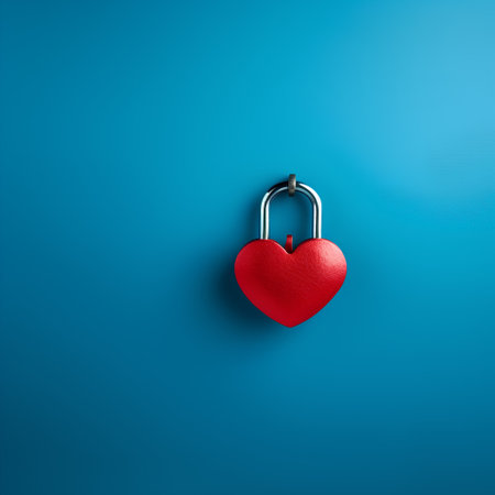 Red heart shaped padlock on blue background. Valentine's day conceptの素材
