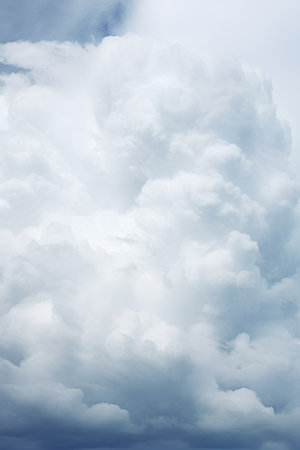Blue sky background with white clouds. Abstract nature background. Copy space.の素材