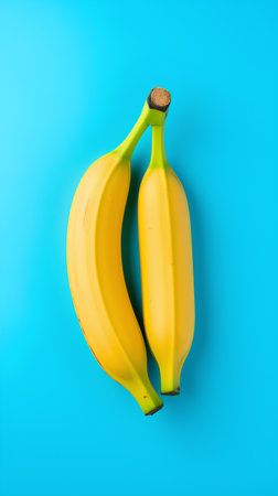 Bunch of bananas on blue background. Minimal summer concept.の素材