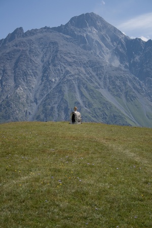 Cross monument with a shrine carved in stone; Kazbegi