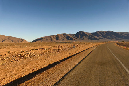 Road in the Sahara desert in Morocco, Africa. Blue sky. Morocco, Tata valley rock formations. province of Souss Massaの写真素材