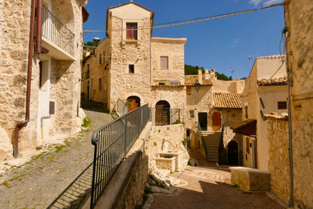 Alleyways. The medieval village of Castel del Monte made up of narrow alleys overlooked by stone houses, inserted in the frame of the Gran Sasso national park. Abruzzo, Italyの写真素材