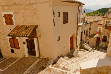 Alleyways. The medieval village of Castel del Monte made up of narrow alleys overlooked by stone houses, inserted in the frame of the Gran Sasso national park. Abruzzo, Italyの写真素材