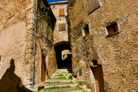 Street in The medieval village of Castel del Monte made up of narrow alleys overlooked by stone houses, inserted in the frame of the Gran Sasso national park. Abruzzo, Italyの写真素材