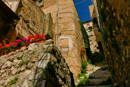 Alleyways. The medieval village of Castel del Monte made up of narrow alleys overlooked by stone houses, inserted in the frame of the Gran Sasso national park. Abruzzo, Italyの写真素材