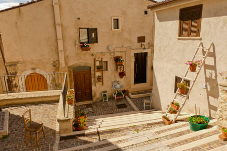 Alleyways. The medieval village of Castel del Monte made up of narrow alleys overlooked by stone houses, inserted in the frame of the Gran Sasso national park. Abruzzo, Italyの写真素材