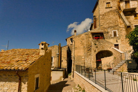 Alleyways. The medieval village of Castel del Monte made up of narrow alleys overlooked by stone houses, inserted in the frame of the Gran Sasso national park. Abruzzo, Italyの写真素材