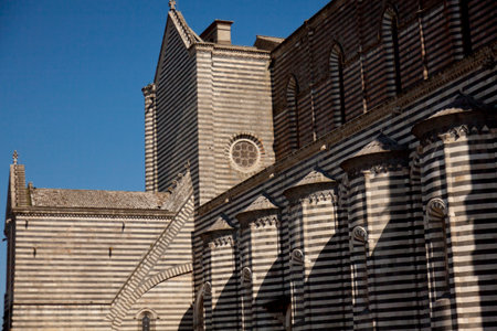 The Cathedral of Orvieto, one of the greatest artistic achievements of the Italian late Middle Ages with our Gothic-style facadeの写真素材