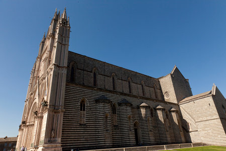 The Cathedral of Orvieto, one of the greatest artistic achievements of the Italian late Middle Ages with our Gothic-style facadeの写真素材