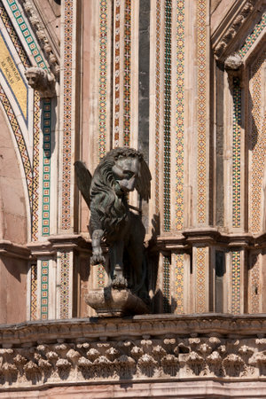 Statue of a lion on the facade of Duomo,Orvieto,middle ages,italian gothic monumentの写真素材