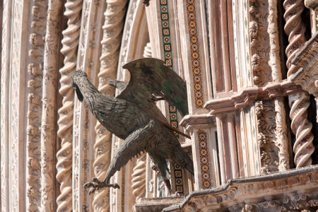 Detail of the facade of The Cathedral of Orvieto, one of the greatest artistic achievements of the Italian late Middle Ages with our Gothic-style facadeの写真素材