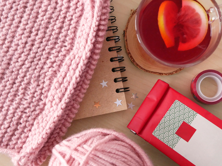 Aromatic tea with yarn, a scarf and a notepad. Top view. Flat lay.の写真素材