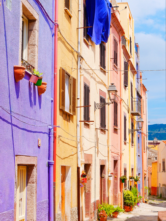 View of the beautiful, colorful, narrow street in Bosa. province of Oristano, Sardinia, Italy.の写真素材
