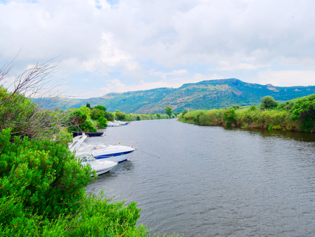 View of the river and fishing boats in the city of Bosa. province of Oristano, Sardinia, Italy.の写真素材