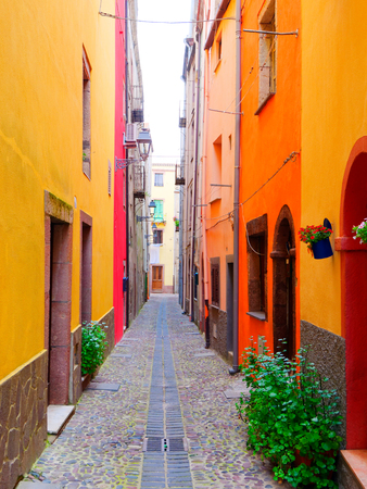View of the beautiful, colorful, narrow street in Bosa. province of Oristano, Sardinia, Italy.の写真素材