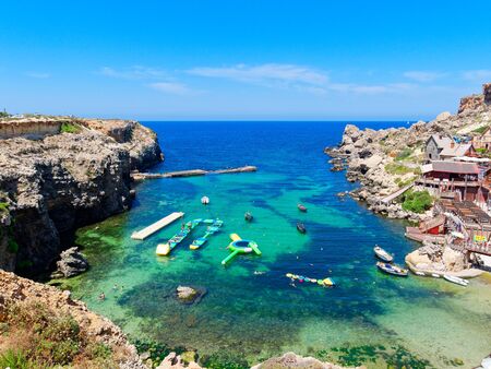 Beautiful Anchor Bay with azure and clear water. Malta.の写真素材