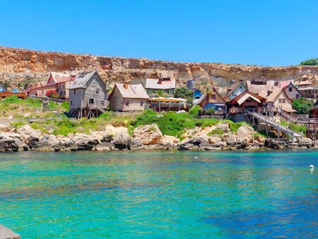 beautiful azure water and the coast at Anchor Bay in Malta.の写真素材