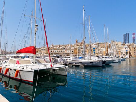 View of the beautiful Vittoriosa yacht marina. In the background the city of Isla. Maltaの写真素材
