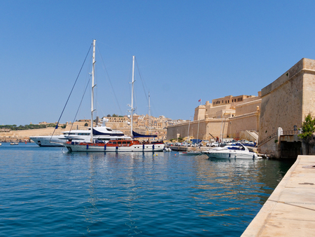 Fort Saint Angelo and the port with beautiful boats in Maltaのeditorial素材