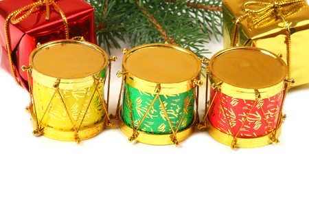 Christmas colorful decoration over white. Three tambourines and gift boxes. Place for your text