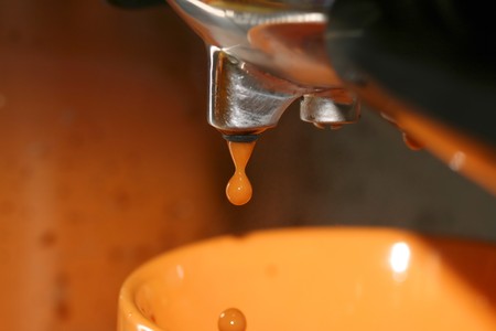 Coffee machine making espresso - closeup of coffee dropの写真素材