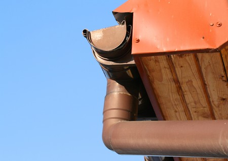 Rain gutter on house with blue sky in the bakcgroundの写真素材