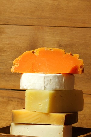 Cheese stacked - various kinds from different countries. Verticalの写真素材