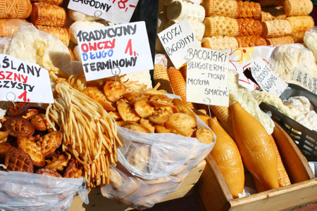 Traditional polish smoked cheese oscypek on outdoor market in Zakopane のeditorial素材