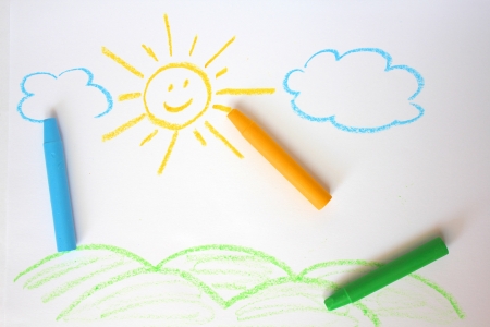 Cute childish drawing by wax crayons. Sun and landscapeの写真素材