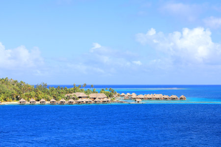 Bungalows on tropical Bora Bora island. Beautiful blue oceanのeditorial素材