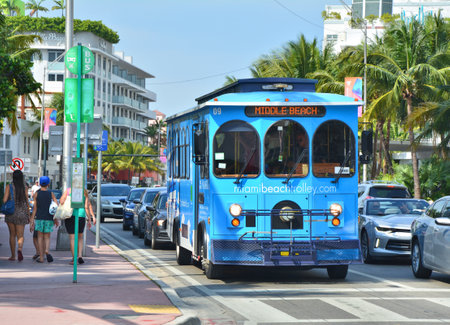 MIAMI BEACH, USA - MARCH 31, 2017 : Blue trolley on the bus stop in Miami Beach. Miami BeachTrolley provides free transportation in the cityのeditorial素材