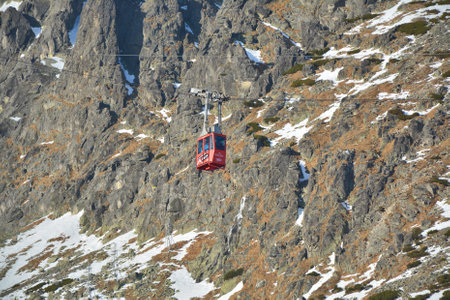 TATRANSKA LOMNICA, SLOVAKIA - JANUARY 1, 2016: Red cable car going to Lomnicky stit peak. It is one of the steepest cable cars in Europeのeditorial素材