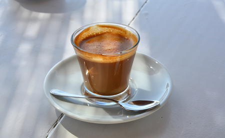 Coffee in glass in outdoor cafe
